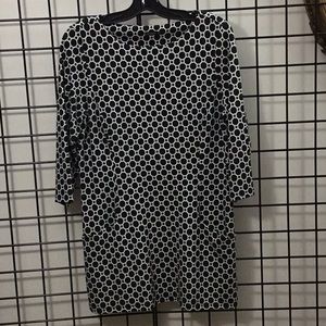 Tunic top. 2 lower pkts.